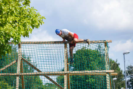 City Plavinas, Latvia. Run race, people were engaged in sports activities. Overcoming various...