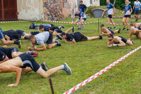 City Plavinas, Latvia. Run race, people were engaged in sports activities. Overcoming various...