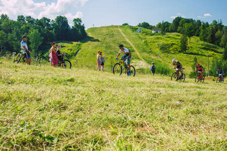 City Cesis, Latvia. Joint cycling mountain ride. A sunny day on the mountain.09.08.2020のeditorial素材