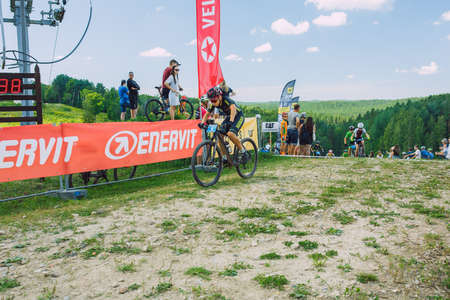 City Cesis, Latvia. Joint cycling mountain ride. A sunny day on the mountain.09.08.2020のeditorial素材