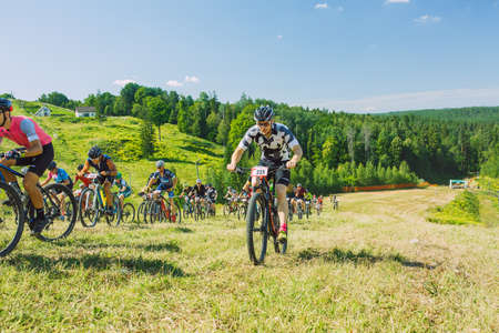 City Cesis, Latvia. Joint cycling mountain ride. A sunny day on the mountain.09.08.2020のeditorial素材