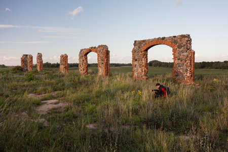 City Smiltene, Latvia.Old brick stonehenge and photographer.Travel photo.の写真素材