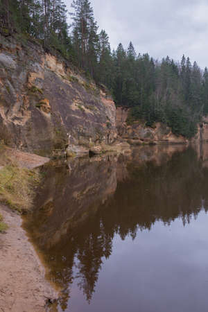 City Cesis, Latvia. Rapid river with stones and trees. Natural flora.Travel photo. 31.10.2020の写真素材
