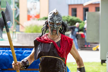City Liepaja,Latvia.A Viking with a weapon in his hands runs along the sea shore.19.09.2020のeditorial素材