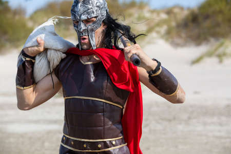 City Liepaja,Latvia.A Viking with a weapon in his hands runs along the sea shore.19.09.2020のeditorial素材