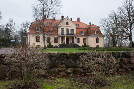 City Liepupe, Latvia. Old yellow manor with garden.Travel photo 19.12.2020のeditorial素材