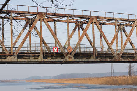 City Riga, Latvia. Frozen river and anglers fishing fish.Travel photo 14.02.2021のeditorial素材