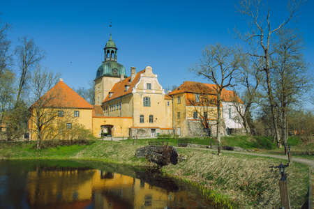 City Straupe, Latvia. Old castle and pond. Travel photo.のeditorial素材