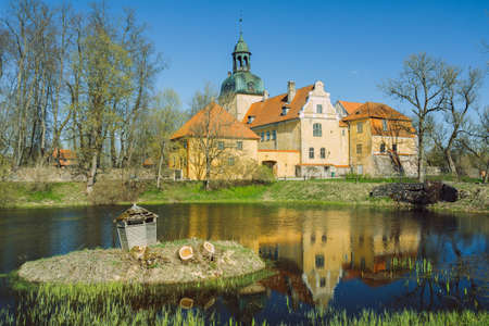 City Straupe, Latvia. Old castle and pond. Travel photo.のeditorial素材
