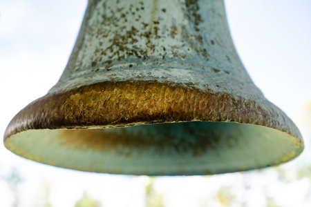 Close up of an old bell in the park. Shallow depth of field.の写真素材