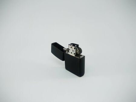 Black metal lighter isolated On a white backgroundの写真素材