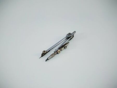 Metal compass drafter isolated on the white backgroundの写真素材