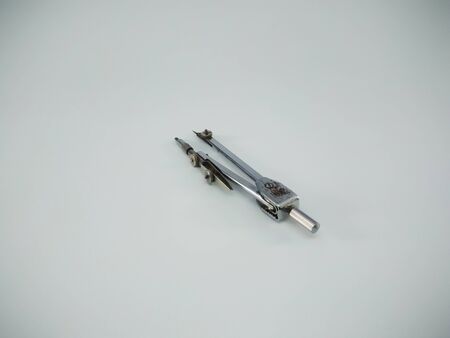 Metal compass drafter isolated on the white backgroundの写真素材