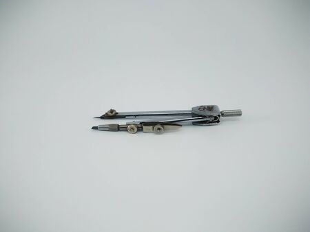 Metal compass drafter isolated on the white backgroundの写真素材
