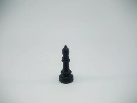 Black plastic bishop chess piece isolated on a white backgroundの写真素材