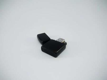 Black metal lighter isolated On a white backgroundの写真素材