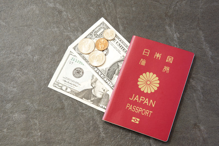 Japanese Passport and US Currencyの写真素材