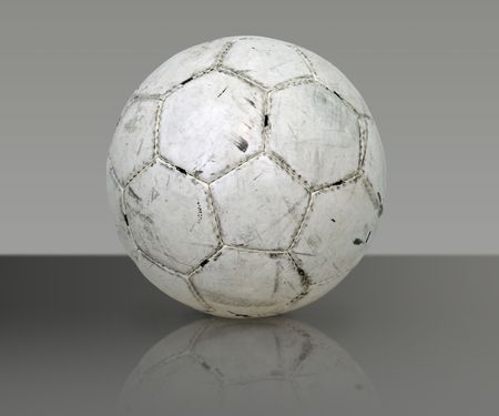 Soccer/Football isolated on a glass surfaceの写真素材