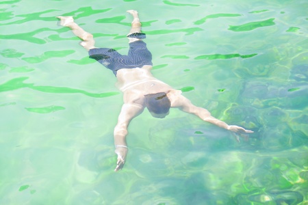 Man swimming underwaterの写真素材