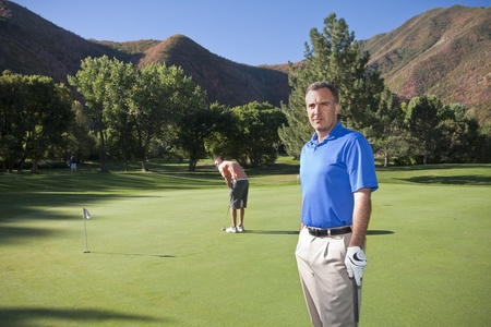 mature golfer getting ready for some golfの写真素材