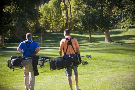 Golfers walking on the Golf Courseの写真素材
