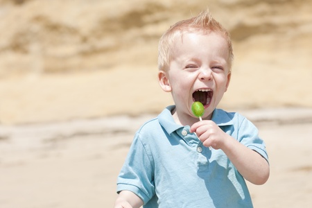Child Taking a Big lick on his lollipopの写真素材