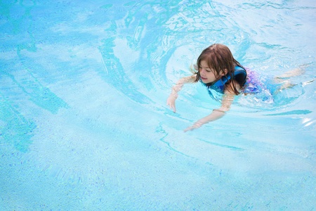Child learning to swim (Lots of Copy Space)の写真素材