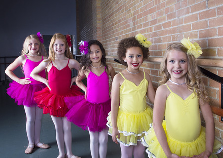 Cute young ballerinas at a dance studio (diverse group of girls)の写真素材