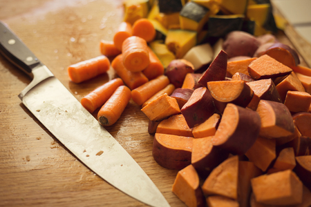 Chopped root vegetables in the kitchenの写真素材