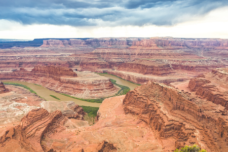 Arial view of the beautiful canyons of the Colorado River at Dead Horse Point State Park near Moab, Utah. Admiring the beauty of the scenic destinationの写真素材