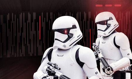 Two individuals dress up in Star Wars Storm Trooper costumes at a Star Wars event in February, 2017