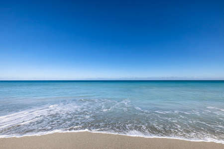 Beautiful and scenic ocean view landscape. Tranquil and gorgeous deep blue ocean and blue skyの写真素材