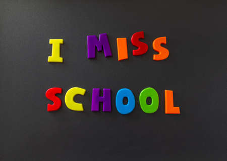 The words I miss school written on a refrigerator door with magnet letters.の写真素材