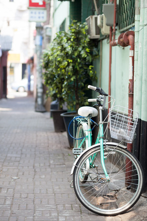 Retro style bicycle at narrow street in Seoul, Koreaの写真素材