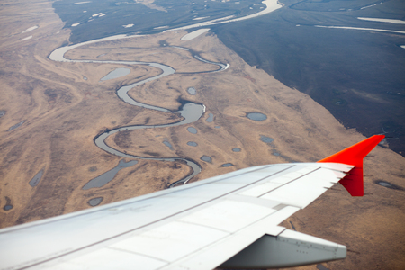 Spring land view from airplane window during landing in Khabarovskの写真素材