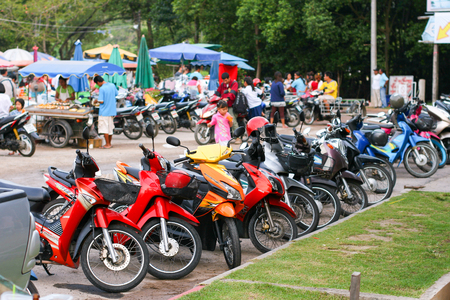 PHUKET, THAILAND - MARCH 01, 2011: Motorbikes at food market in Thailandのeditorial素材
