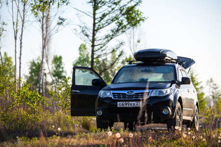 Khabarovsk, Russia - May 23, 2020: Subaru Forester with roof box at dirt road in the forestのeditorial素材