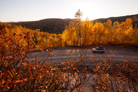 Khabarovsk, Russia - September 26, 2021: Mitsubishi Pajero on scenic autumn road in mountainsのeditorial素材