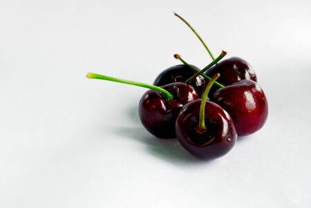 Red cherries isolate on white backgroundの写真素材