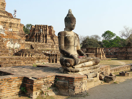 Old Buddha statue at Wat Chai Watthanaram, Ayuttaya,Thailandの写真素材