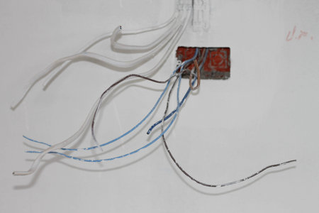 hand with screwdriver, light switch and plug socketの写真素材