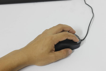 male hands with dermatoses using mouse in white backgroundの写真素材