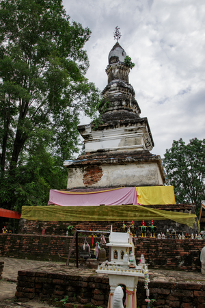 Image of an ancient pagoda is located in the temple in bantak district. Buddhist temple in thailand.のeditorial素材