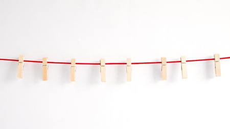 wood clip with red ropeの写真素材
