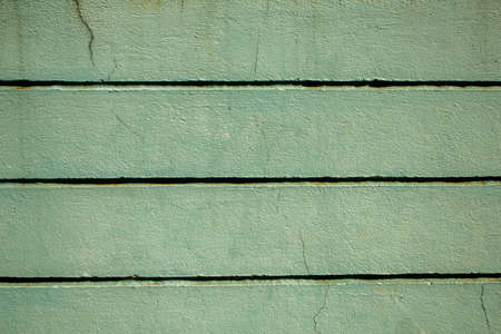 blue old concrete wall cracked. horizontal lines. rough surface texture