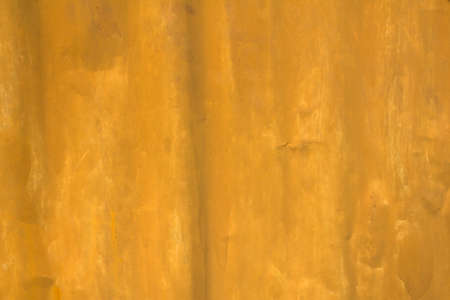 old dirty crumpled yellow metal sheet. rough surface texture