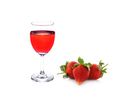 a glass of strawberries on white backgroundの写真素材