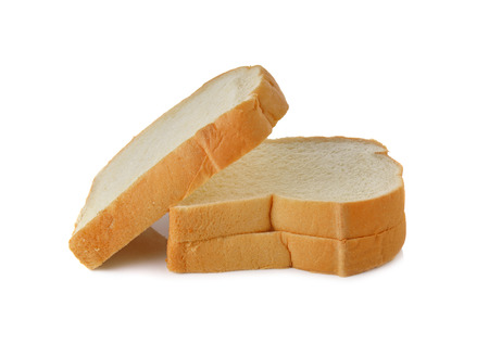 stack of sliced American white bread on white backgroundの写真素材