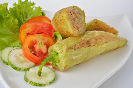 fried green chili pepper stuffing with pork and vermicelli on plateの写真素材