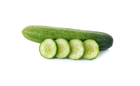 whole and sliced fresh cucumber on white backgroundの写真素材